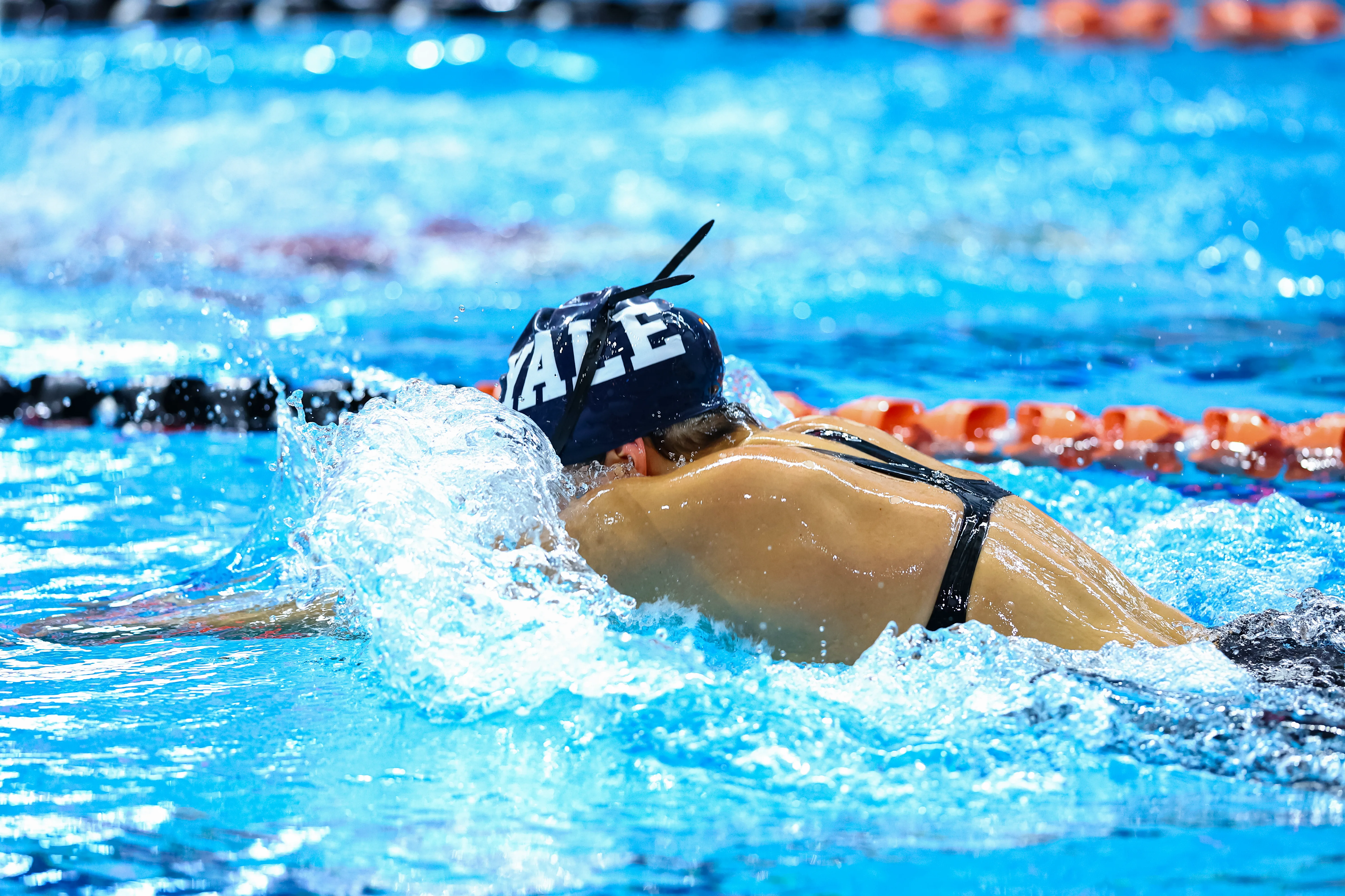 Izz competing in swimming